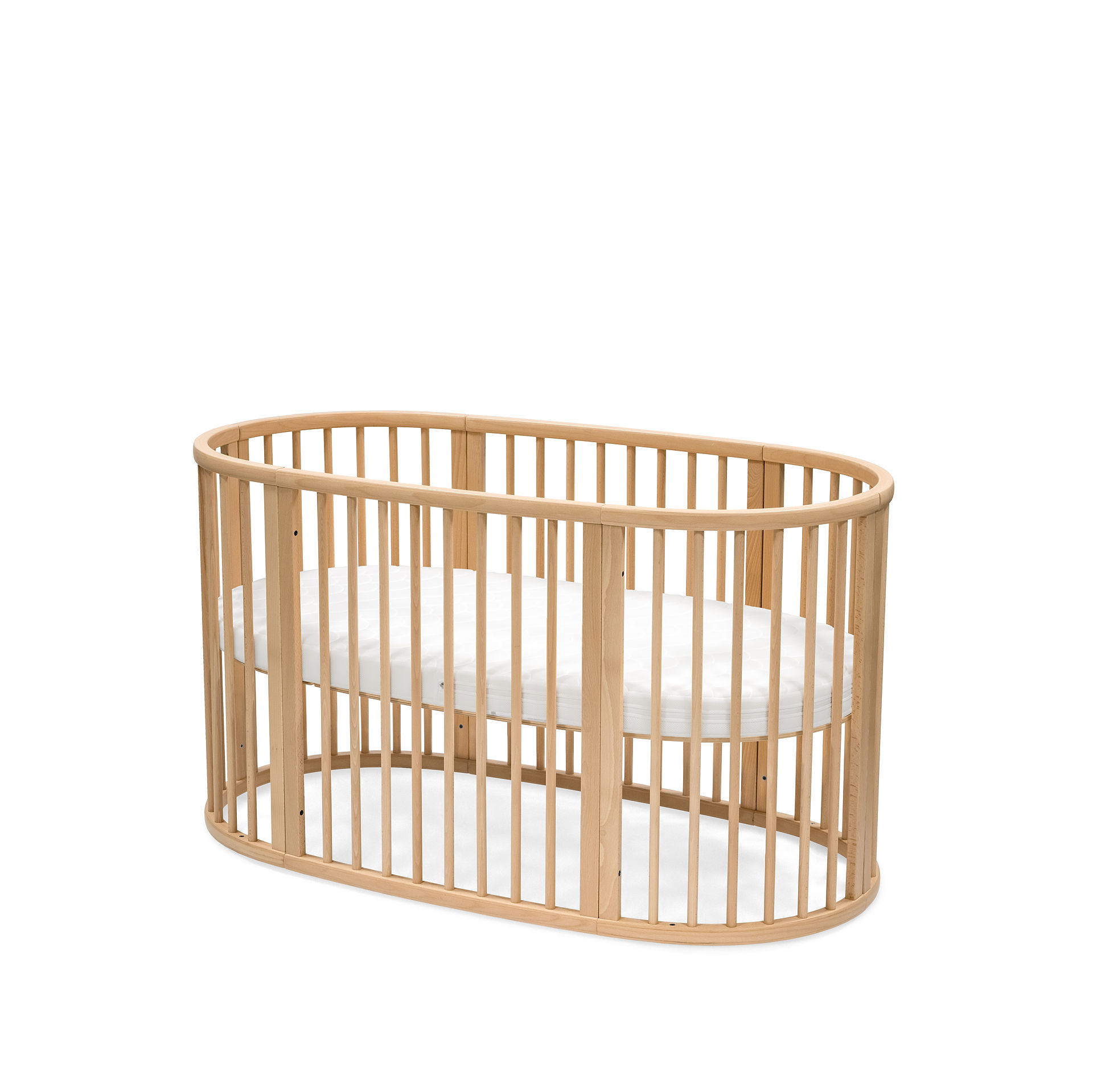 Stokke® Sleepi™ Bed. Natural. Mattress. Closed. Angled view.